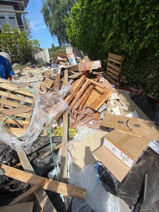Before backyard debris cleanup in San Diego
